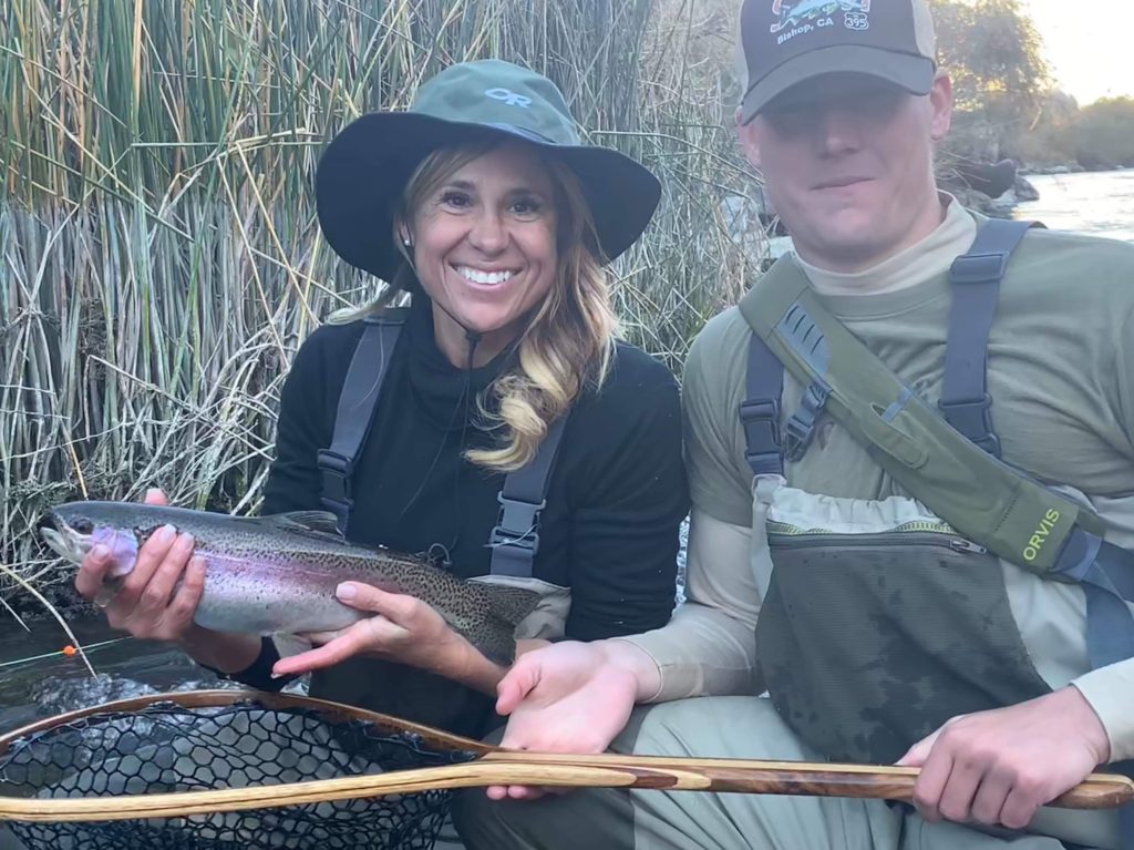 Attractive woman and Son hold up a nice rainbow trout caught on the lower Owens River